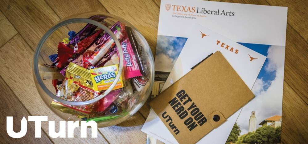 Table with a bowl of candy and a "Texas Liberal Arts" pamphlet
